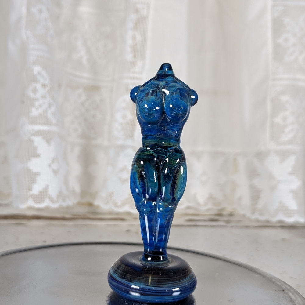 Blue nude female figure sculpture